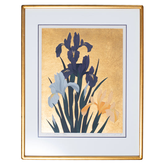 Framed artwork of flowers on a gold background